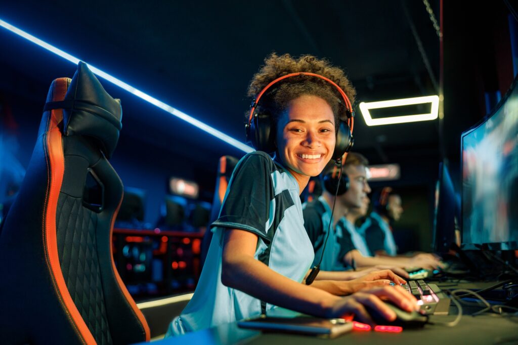 Happy gamer challenges video game in computer club